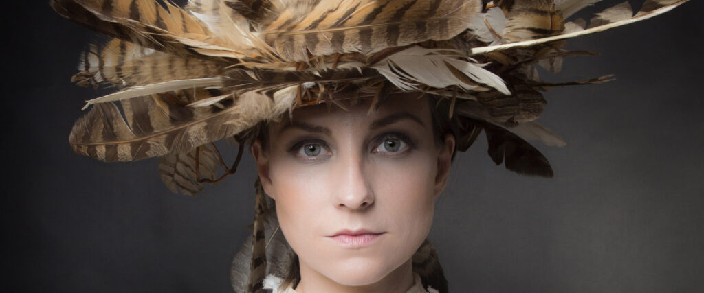 Julie Fowlis wearing a hat with feathers.
