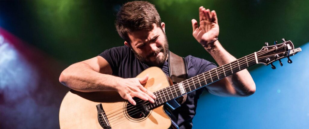 Luca Stricagnoli playing a guitar.
